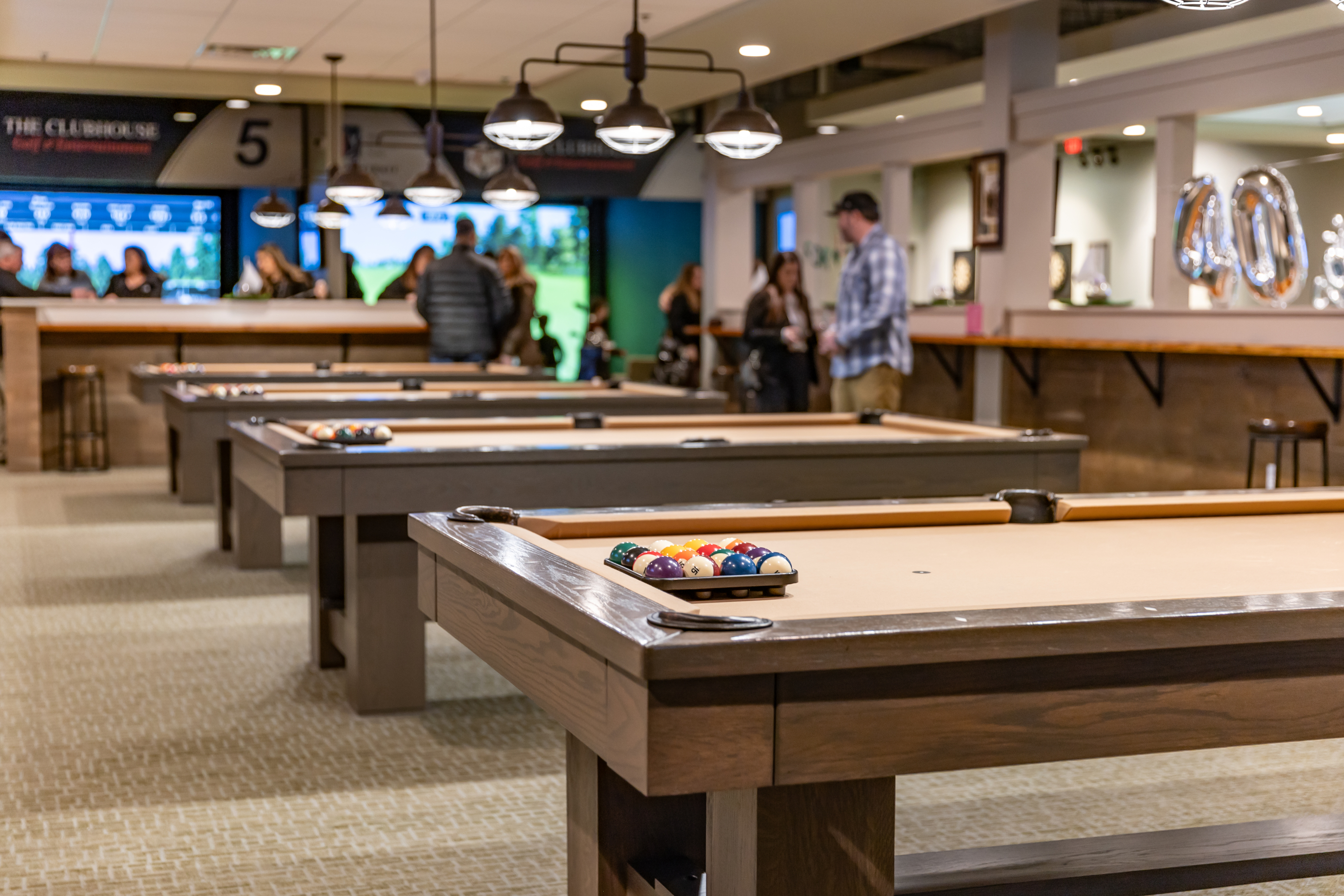 The Clubhouse Golf & Entertainment pool hall exterior/interior